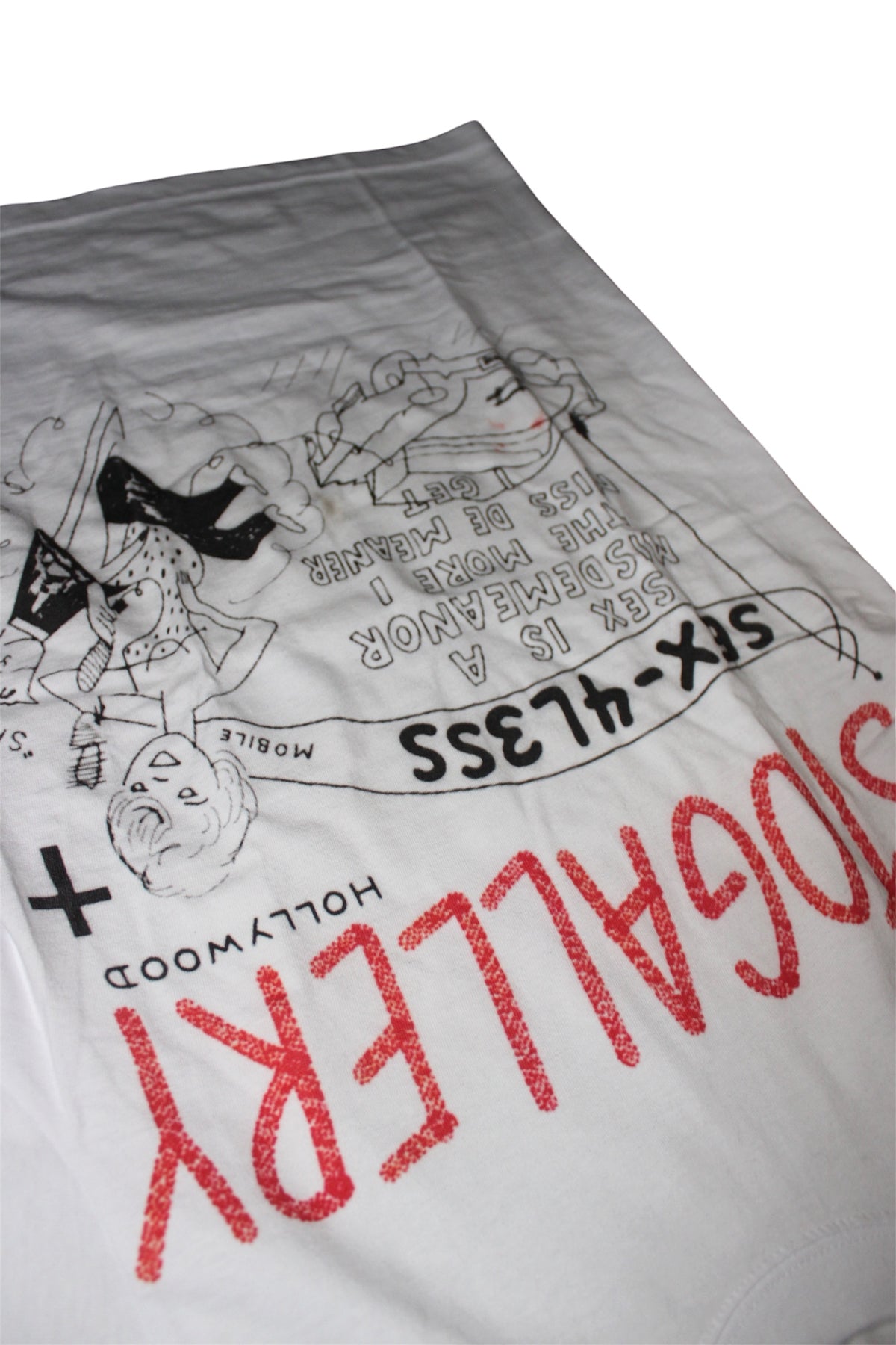 S.T.O GALLERY “Sex-4L3ss” Tee